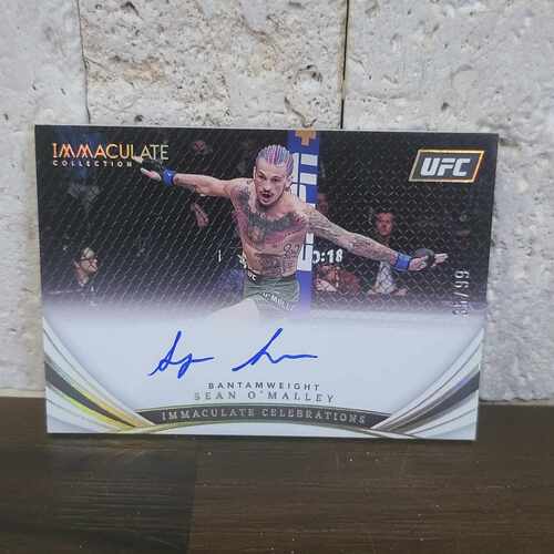 Sean O’Malley UFC Immaculate Celebrations Auto 35/99 autograph